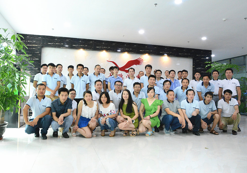 Engineers developing laser cutting machine systems